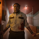 A park ranger (Sam Richardson) holds a pair of axes as he faces down a threat in Werewolves Within.